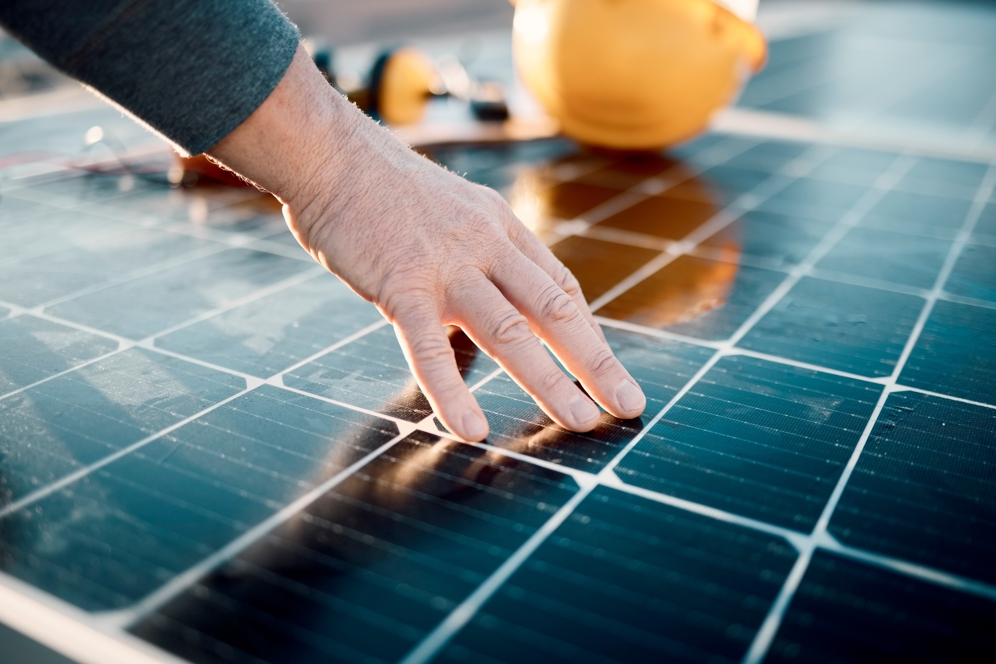 Hands, engineer and solar panel in construction for renewable energy, electricity or technology. Ha